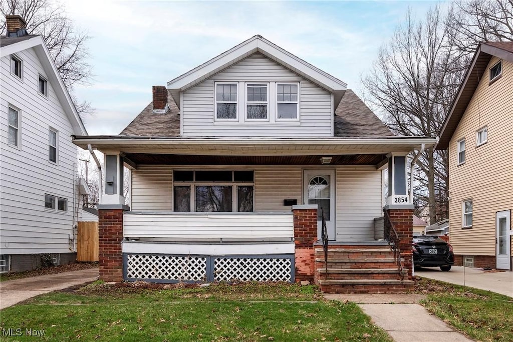 3854 W 132nd St, Cleveland, OH 44111 - bungalow-style house with covered porch and a shingled roof