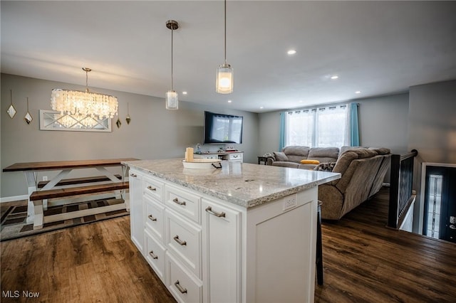 kitchen with recessed lighting, dark wood-style floors, white cabinetry, and an inviting chandelier