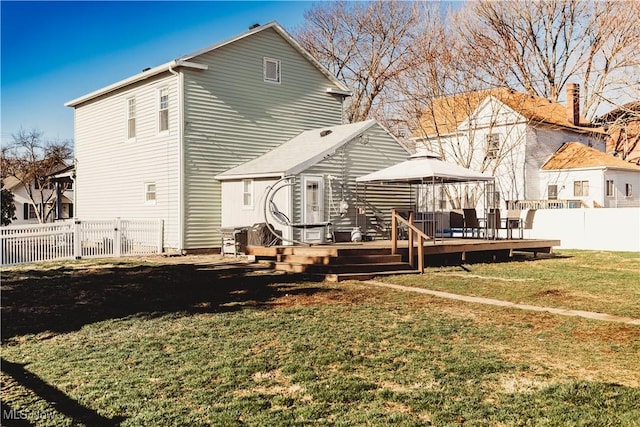 212 E Church St, Warsaw, OH 43844 - back of property with a fenced backyard, a wooden deck, a gazebo, and a yard