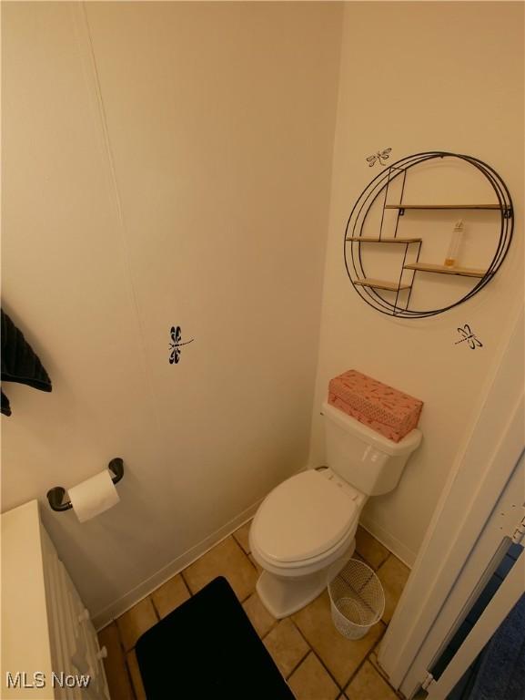 2616 Eldersville Rd, Follansbee, WV 26037 - bathroom with baseboards, toilet, and tile patterned flooring