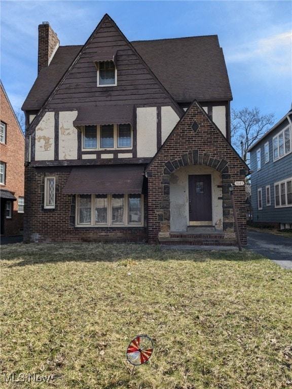 3643 Lindholm Rd, Shaker Heights, OH 44120 - view of front facade featuring a chimney and a front lawn