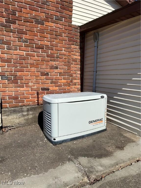 167 Andover Rd, Woodsfield, OH 43793 - exterior view of a power unit and brick siding