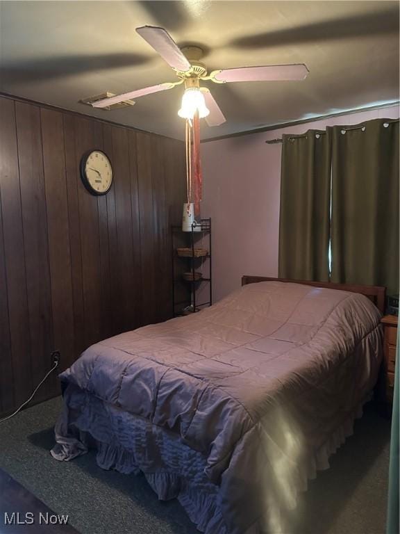 167 Andover Rd, Woodsfield, OH 43793 - bedroom with ceiling fan and wood walls