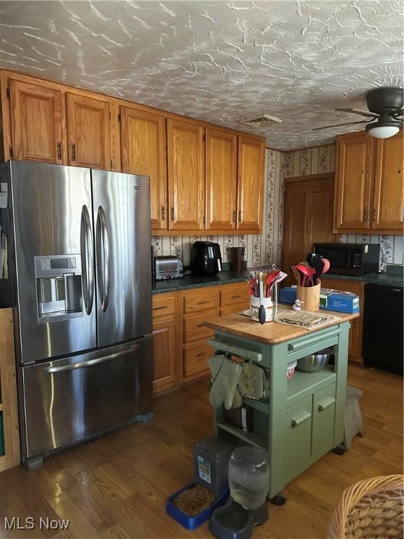 167 Andover Rd, Woodsfield, OH 43793 - kitchen featuring black appliances, brown cabinets, wood finished floors, and open shelves