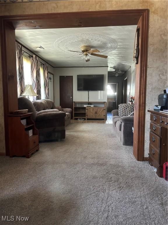 167 Andover Rd, Woodsfield, OH 43793 - carpeted living area featuring a ceiling fan