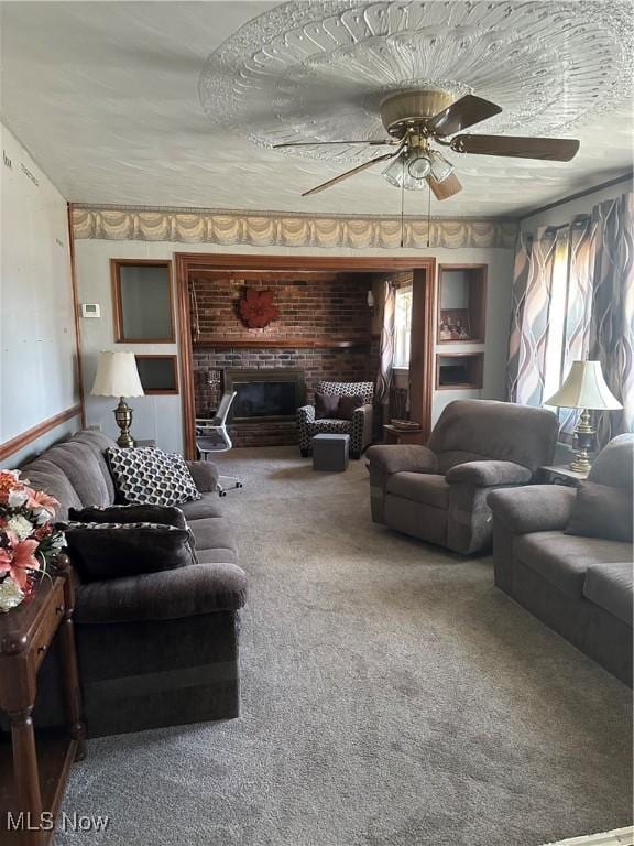 167 Andover Rd, Woodsfield, OH 43793 - living room with carpet flooring, a ceiling fan, and a fireplace