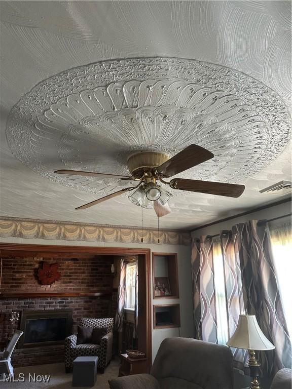 167 Andover Rd, Woodsfield, OH 43793 - detailed view of ceiling fan and a fireplace