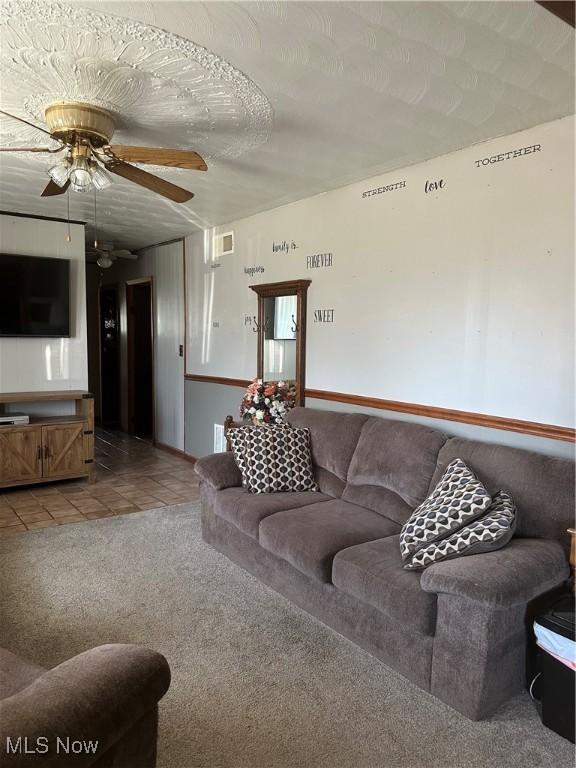 167 Andover Rd, Woodsfield, OH 43793 - living area featuring light colored carpet, ceiling fan, and light tile patterned flooring