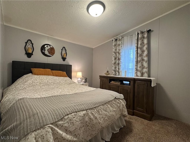 carpeted bedroom with a textured ceiling and ornamental molding