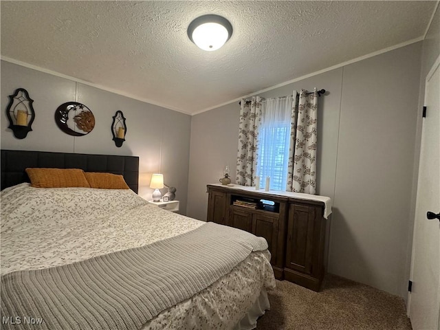 bedroom with a textured ceiling, crown molding, and carpet