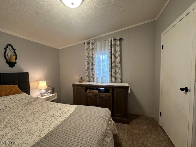 carpeted bedroom with a textured ceiling and crown molding
