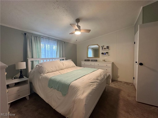 carpeted bedroom featuring a textured ceiling, a ceiling fan, and vaulted ceiling