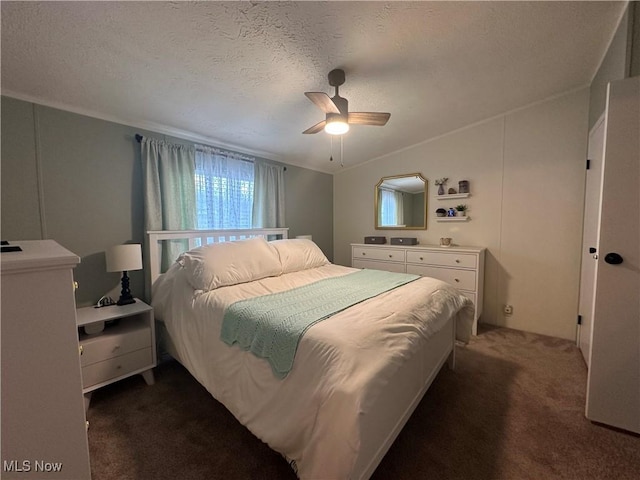 carpeted bedroom with a textured ceiling, a ceiling fan, and vaulted ceiling