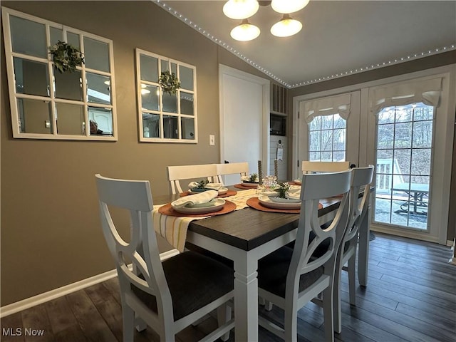 dining space featuring hardwood / wood-style floors, french doors, and baseboards
