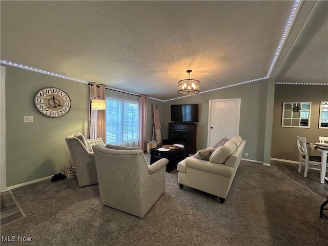 living room with baseboards, carpet floors, an inviting chandelier, vaulted ceiling, and a textured ceiling