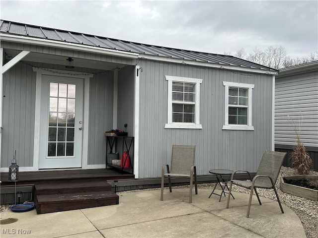 doorway to property with a patio area