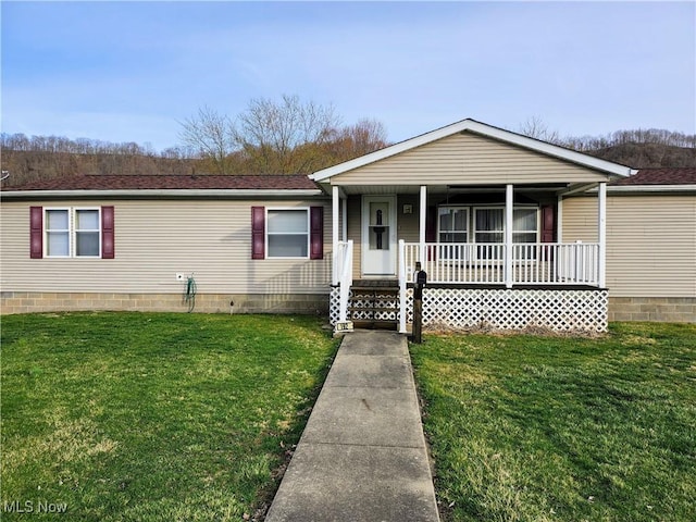 view of front of home featuring crawl space, a porch, a front yard, and a shingled roof