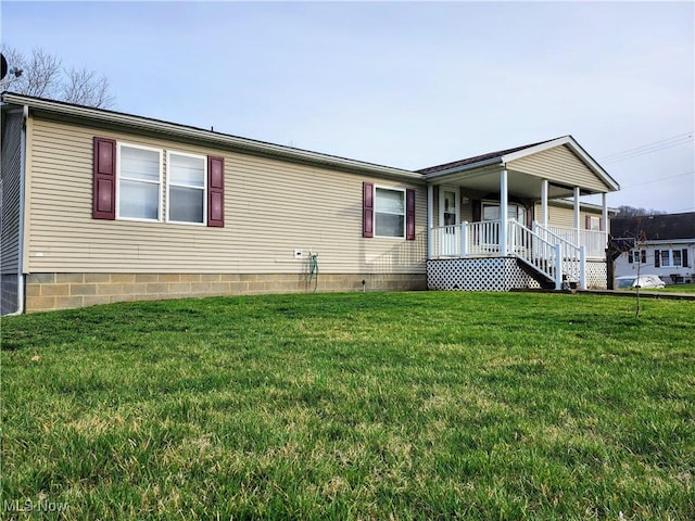 view of front of property with covered porch and a front yard