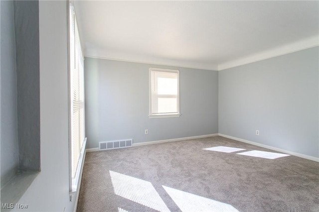 15921 Cloverside Ave, Cleveland, OH 44128 - carpeted empty room with visible vents, baseboards, and crown molding