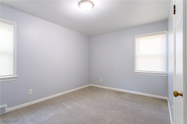 15921 Cloverside Ave, Cleveland, OH 44128 - spare room featuring baseboards and carpet flooring