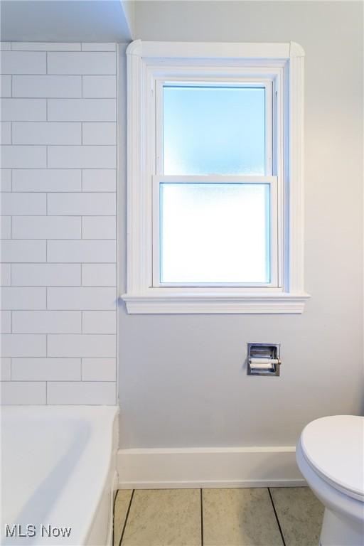 15921 Cloverside Ave, Cleveland, OH 44128 - full bath with tile patterned flooring, toilet, and baseboards