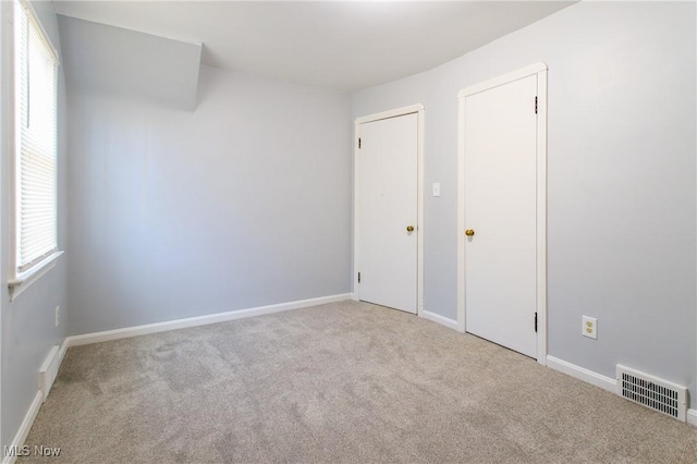 15921 Cloverside Ave, Cleveland, OH 44128 - unfurnished bedroom featuring carpet, visible vents, and baseboards