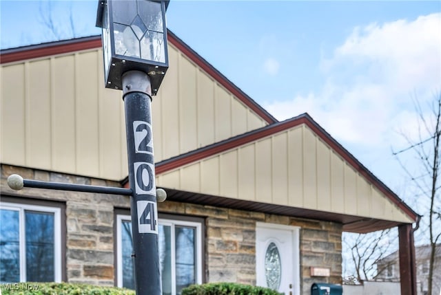 details with stone siding and board and batten siding