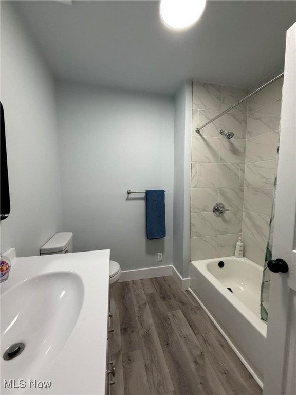 163 The Brooklands, Akron, OH 44305 - bathroom featuring toilet, wood finished floors, shower / bath combination, vanity, and baseboards