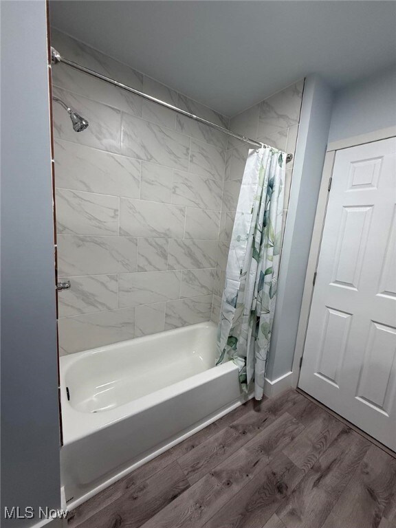 163 The Brooklands, Akron, OH 44305 - bathroom featuring shower / bath combination with curtain and wood finished floors