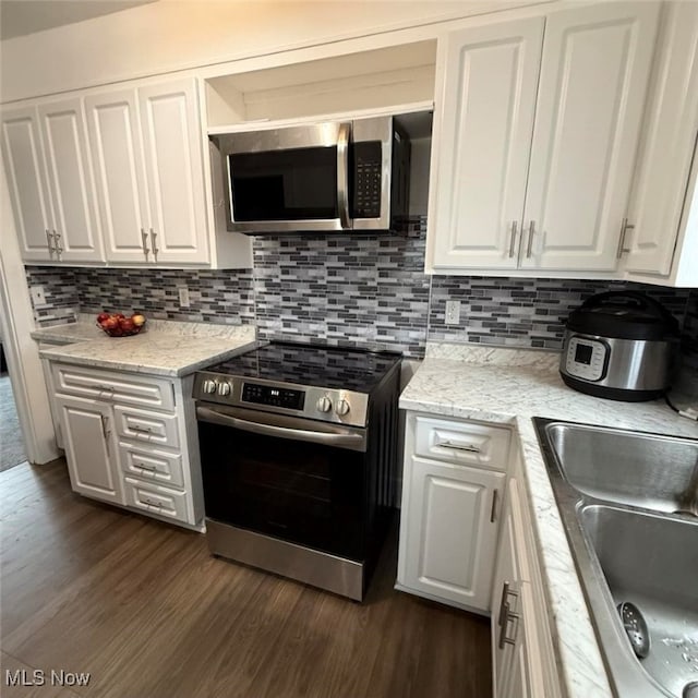 163 The Brooklands, Akron, OH 44305 - kitchen with appliances with stainless steel finishes, white cabinetry, a sink, and dark wood-style floors