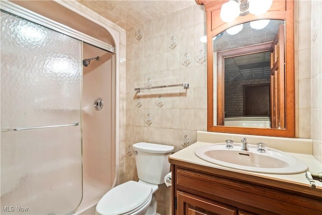 8187 N Lima Rd, Poland, OH 44514 - bathroom with tile walls, a shower stall, toilet, and vanity