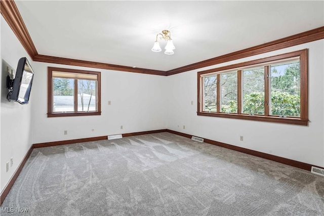8187 N Lima Rd, Poland, OH 44514 - spare room featuring crown molding, carpet, baseboards, and a chandelier