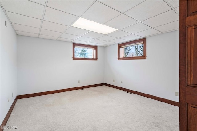 8187 N Lima Rd, Poland, OH 44514 - basement featuring light colored carpet, a paneled ceiling, and baseboards