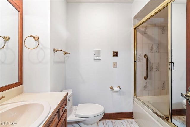 8187 N Lima Rd, Poland, OH 44514 - full bathroom with toilet, vanity, baseboards, and shower / bath combination with glass door