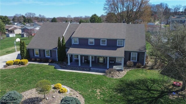 6 Maplewood Dr, Williamstown, WV 26187 - traditional-style home featuring covered porch and a front yard