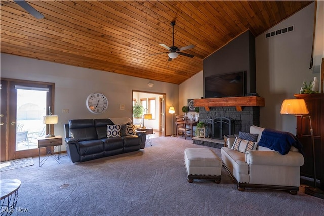 6 Maplewood Dr, Williamstown, WV 26187 - carpeted living room featuring a stone fireplace, visible vents, wooden ceiling, and ceiling fan