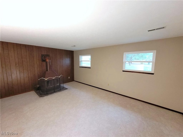 10360 Rischel Rd, Wadsworth, OH 44281 - interior space with baseboards, visible vents, wood walls, and carpet