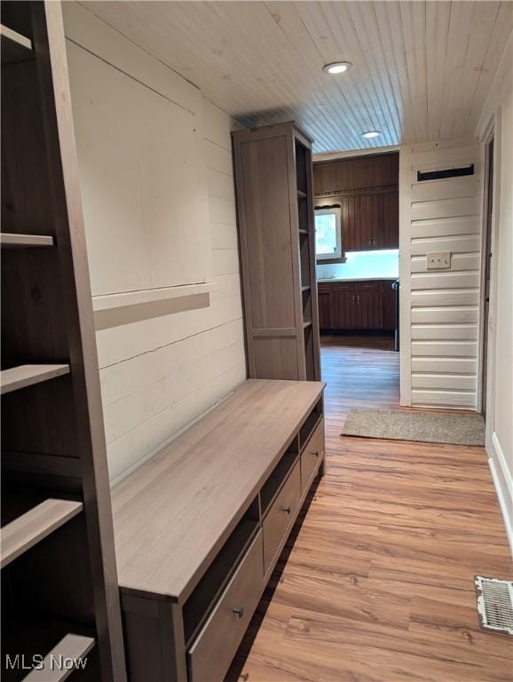 11154 Edgerton Rd, North Royalton, OH 44133 - mudroom featuring light wood-type flooring, wooden ceiling, and wooden walls
