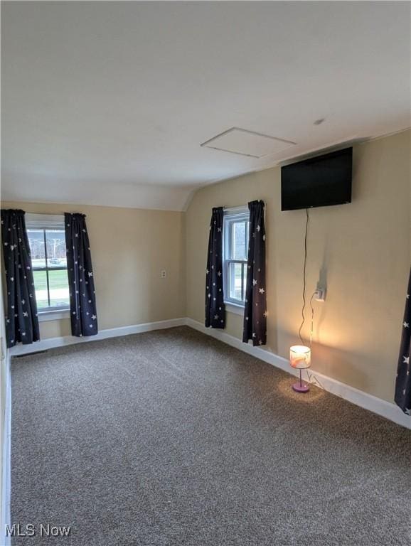 11154 Edgerton Rd, North Royalton, OH 44133 - unfurnished living room with carpet, healthy amount of natural light, and lofted ceiling