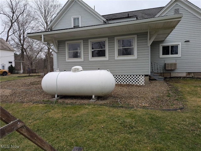11154 Edgerton Rd, North Royalton, OH 44133 - rear view of property with a yard, entry steps, a wall unit AC, and a shingled roof