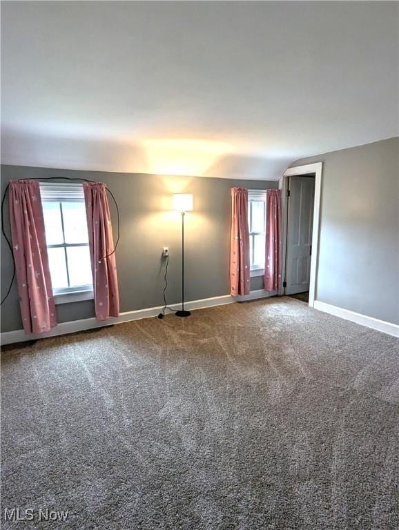 11154 Edgerton Rd, North Royalton, OH 44133 - carpeted empty room featuring baseboards and vaulted ceiling