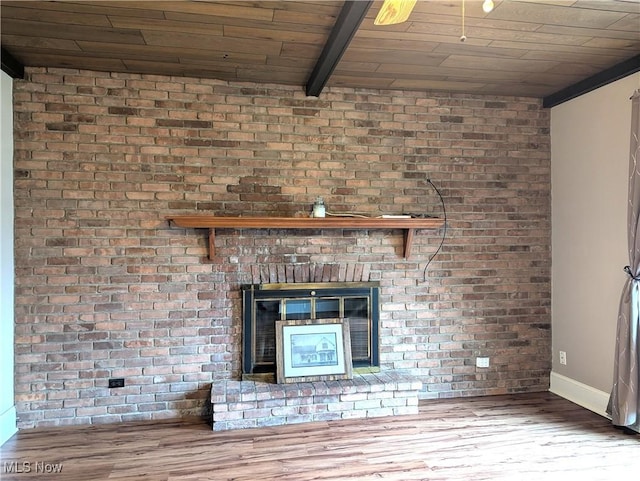 11154 Edgerton Rd, North Royalton, OH 44133 - unfurnished living room featuring a brick fireplace, wooden ceiling, and wood finished floors