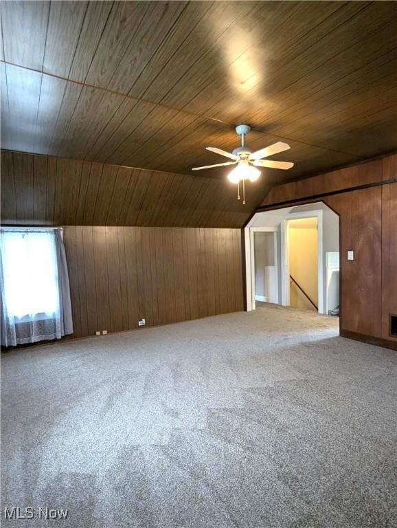 11154 Edgerton Rd, North Royalton, OH 44133 - additional living space with wooden ceiling, wooden walls, a ceiling fan, carpet flooring, and vaulted ceiling