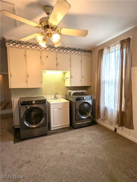11154 Edgerton Rd, North Royalton, OH 44133 - washroom with cabinet space, separate washer and dryer, ceiling fan, and carpet floors