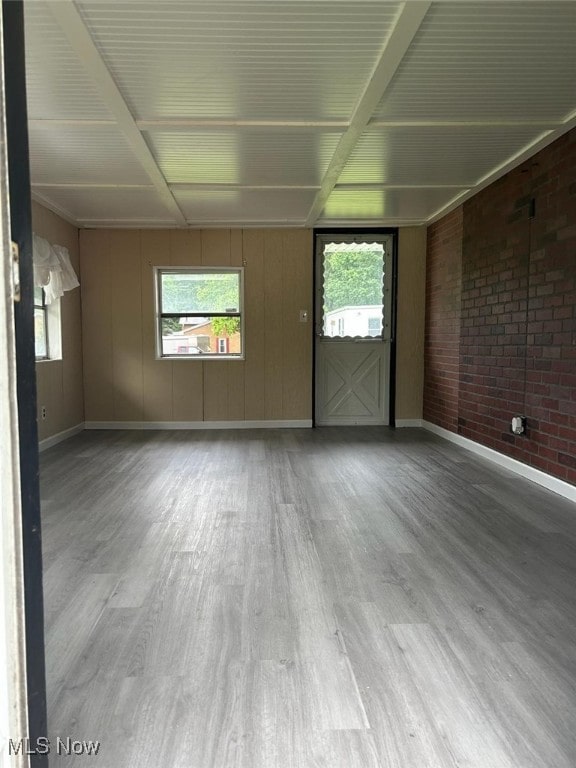 11154 Edgerton Rd, North Royalton, OH 44133 - spare room featuring wood finished floors and beamed ceiling