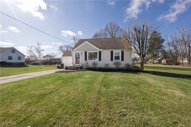 view of front of house featuring driveway, a front yard, a garage, and roof with shingles