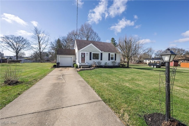view of front of property with a front lawn, fence, a garage, and concrete driveway