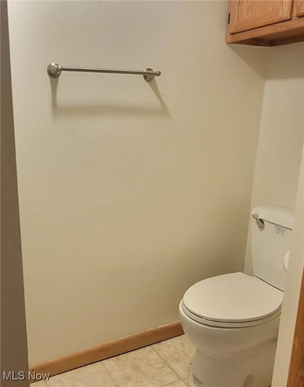 712 Circle Dr, Belpre, OH 45714 - bathroom with baseboards, toilet, and tile patterned flooring