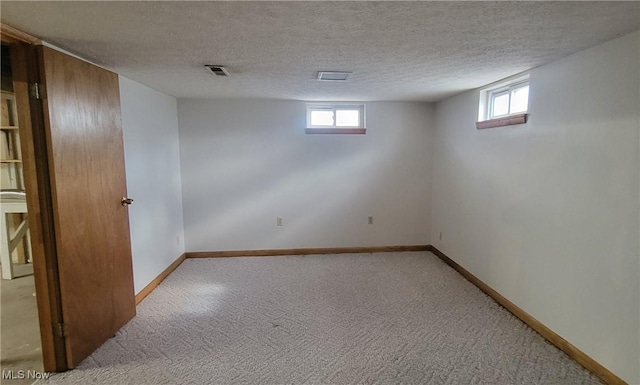 712 Circle Dr, Belpre, OH 45714 - basement featuring plenty of natural light, baseboards, and a textured ceiling