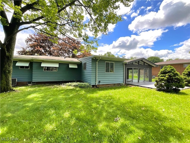 6372 Tanglewood Ln, Seven Hills, OH 44131 - rear view of house with a yard, central air condition unit, and a patio